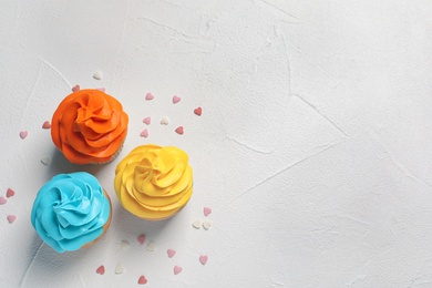 Delicious birthday cupcakes on light background Photo of Delicious birthday cupcakes on light background
