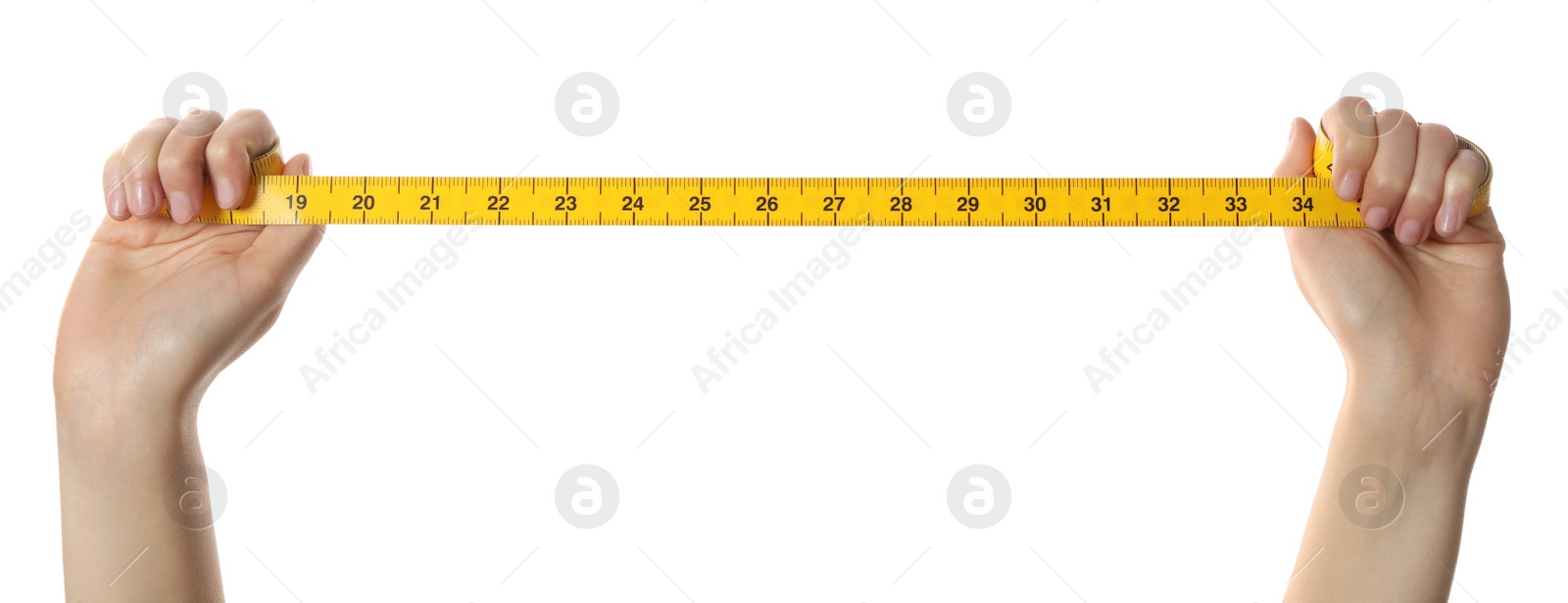 Woman holding yellow measuring tape on white background, closeup Photo of Woman holding yellow measuring tape on white background, closeup