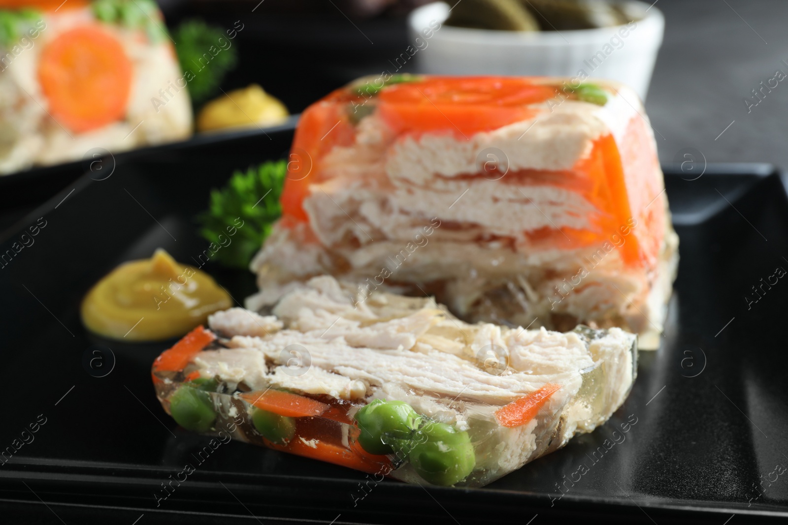 Delicious chicken aspic with vegetables on plate, closeup Photo of Delicious chicken aspic with vegetables on plate, closeup