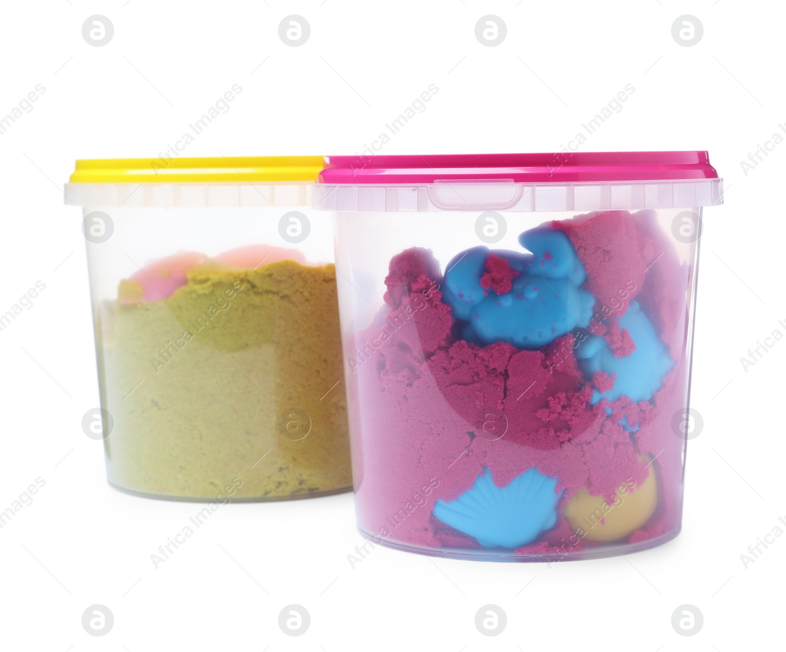 Kinetic sand and toys in buckets on white background Photo of Kinetic sand and toys in buckets on white background