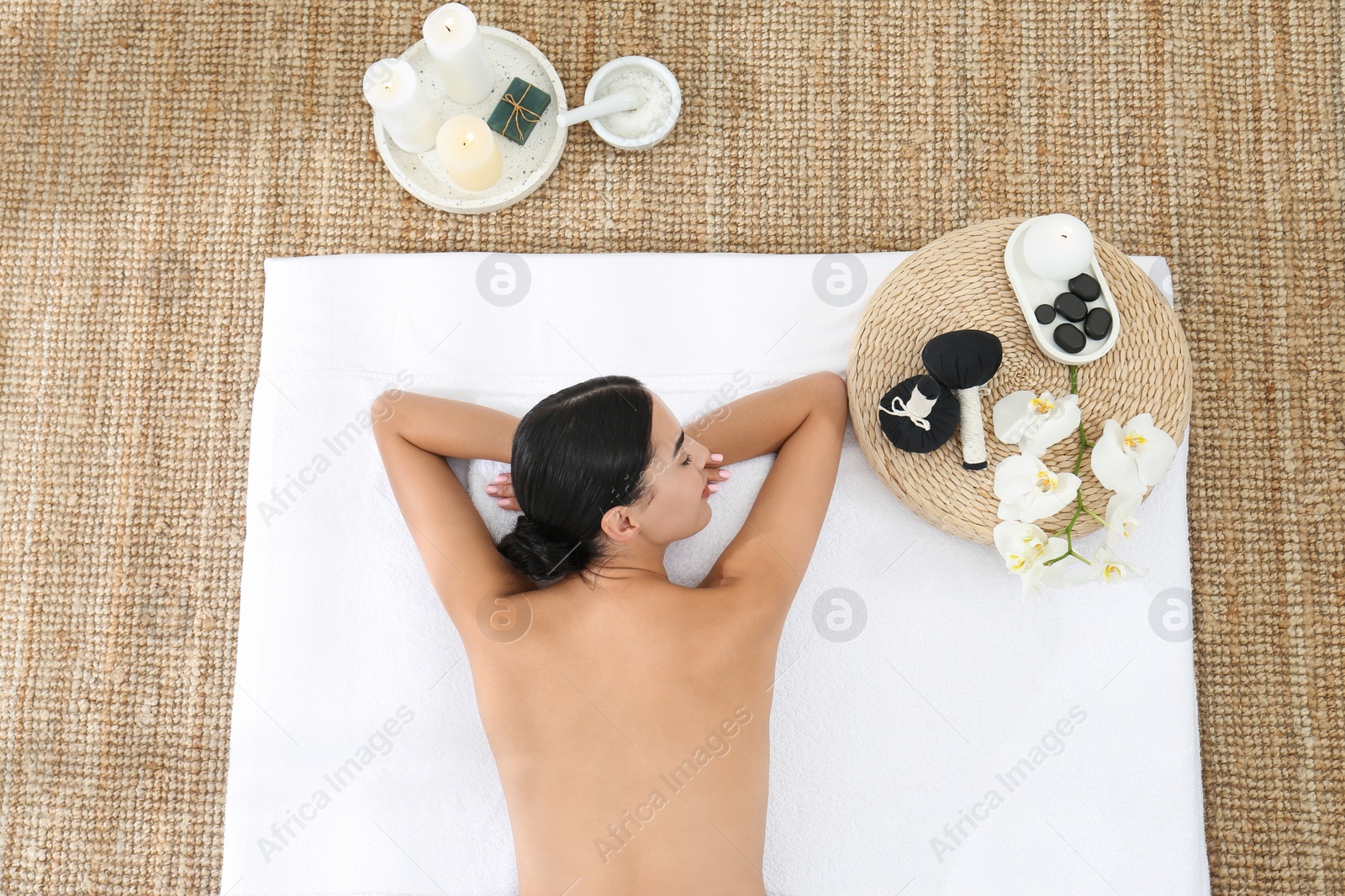 Young woman relaxing in spa salon, top view Photo of Young woman relaxing in spa salon, top view