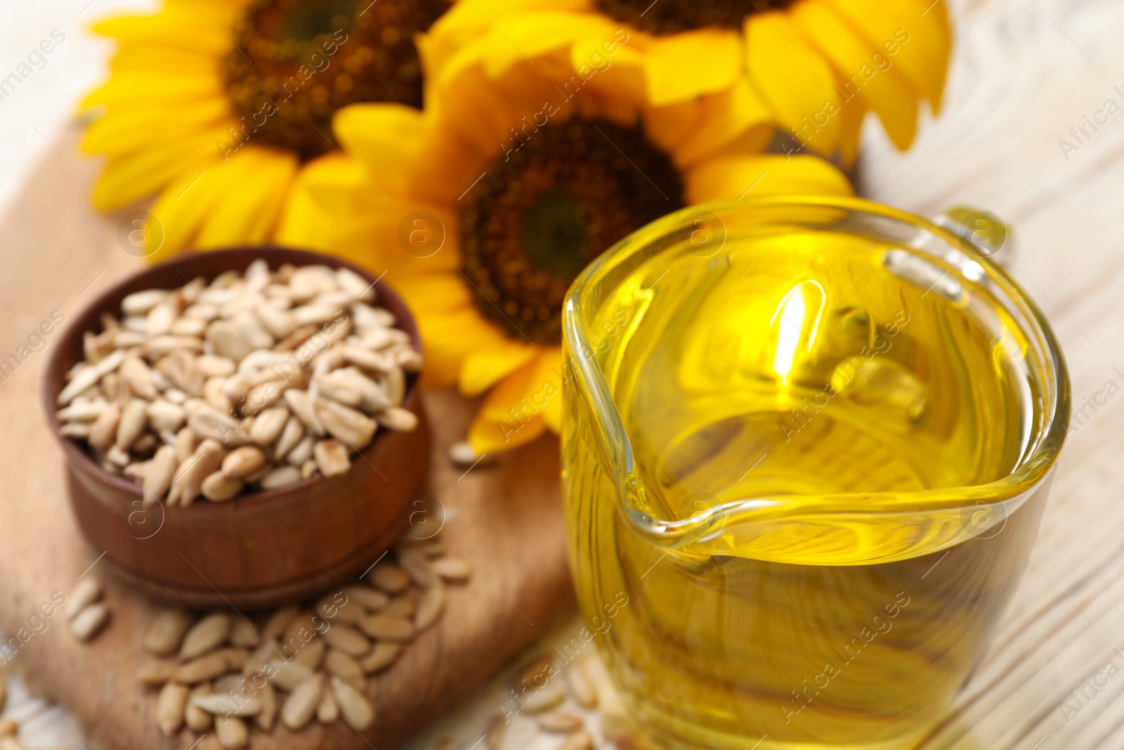 Sunflower oil in glass jug on table, closeup. Space for text Photo of Sunflower oil in glass jug on table, closeup. Space for text