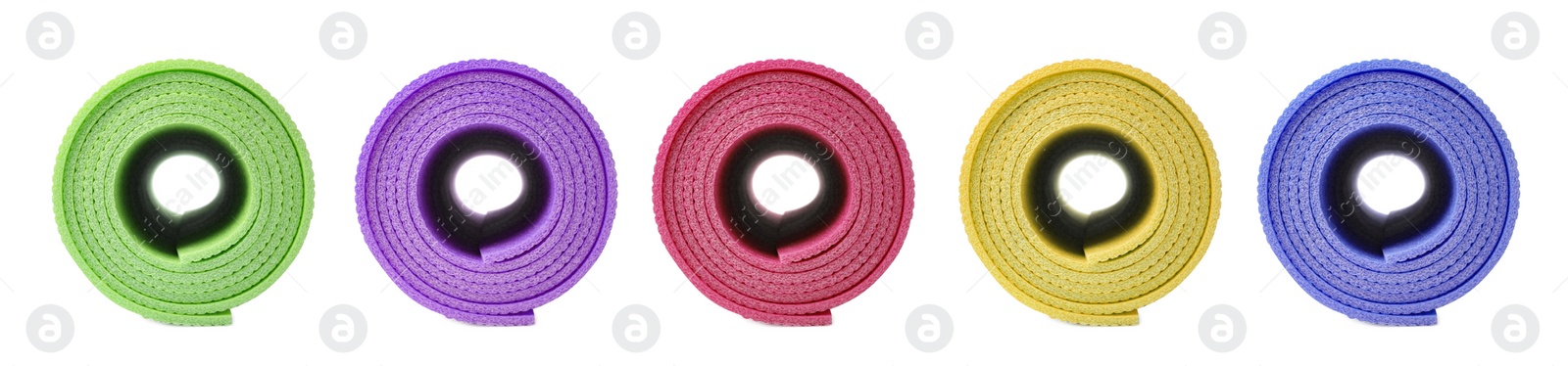 Image of Set with different bright rolled camping mats on white background. Banner design  