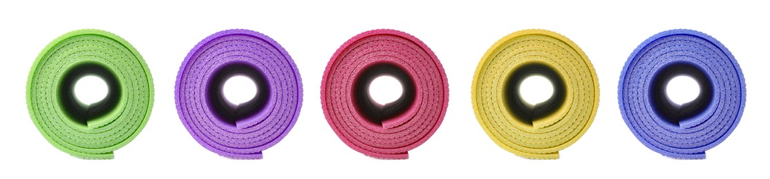 Set with different bright rolled camping mats on white background. Banner design Image of Set with different bright rolled camping mats on white background. Banner design