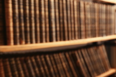 Blurred view of books on shelves in library Photo of Blurred view of books on shelves in library