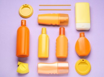 Different plastic items on lilac background, flat lay Photo of Different plastic items on lilac background, flat lay