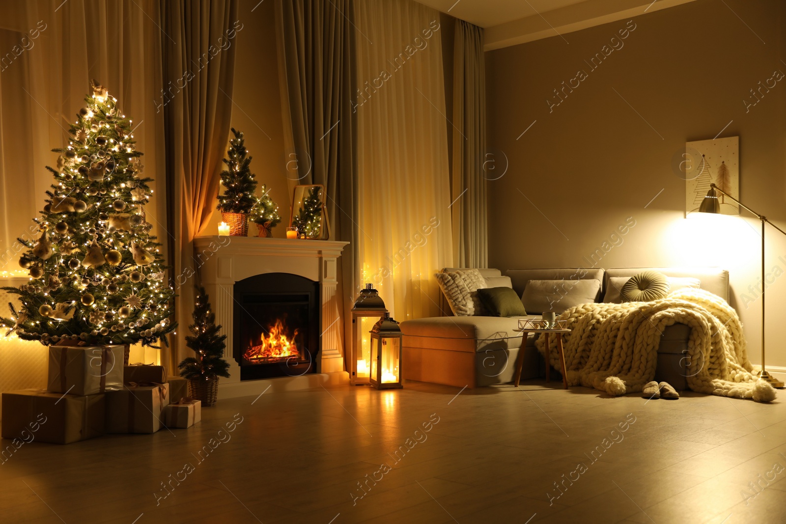 Stylish living room interior with beautiful fireplace, Christmas tree Photo of Stylish living room interior with beautiful fireplace, Christmas tree