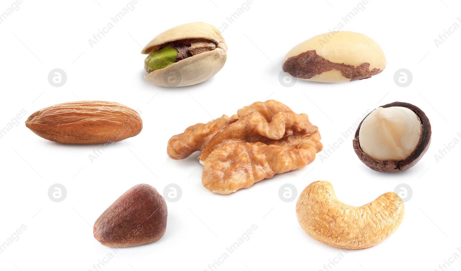Set with different tasty nuts on white background Image of Set with different tasty nuts on white background