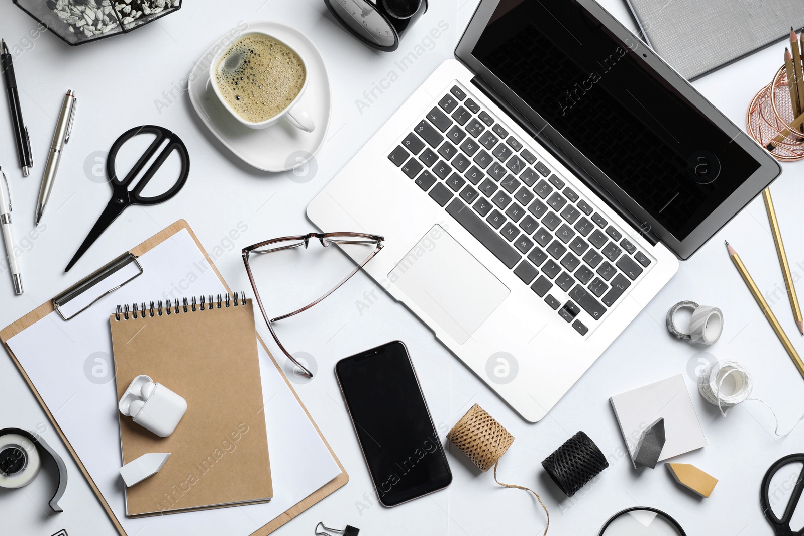 Flat lay composition with laptop, smartphone and stationery on white table. Designer's workplace Photo of Flat lay composition with laptop, smartphone and stationery on white table. Designer's workplace