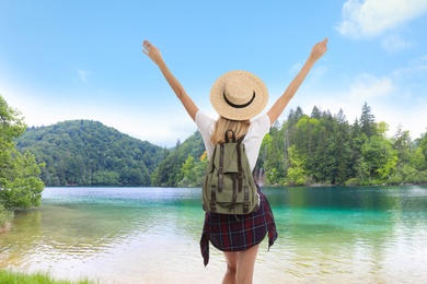 Tourist with travel backpack enjoying mountain landscape during summer vacation trip Image of Tourist with travel backpack enjoying mountain landscape during summer vacation trip