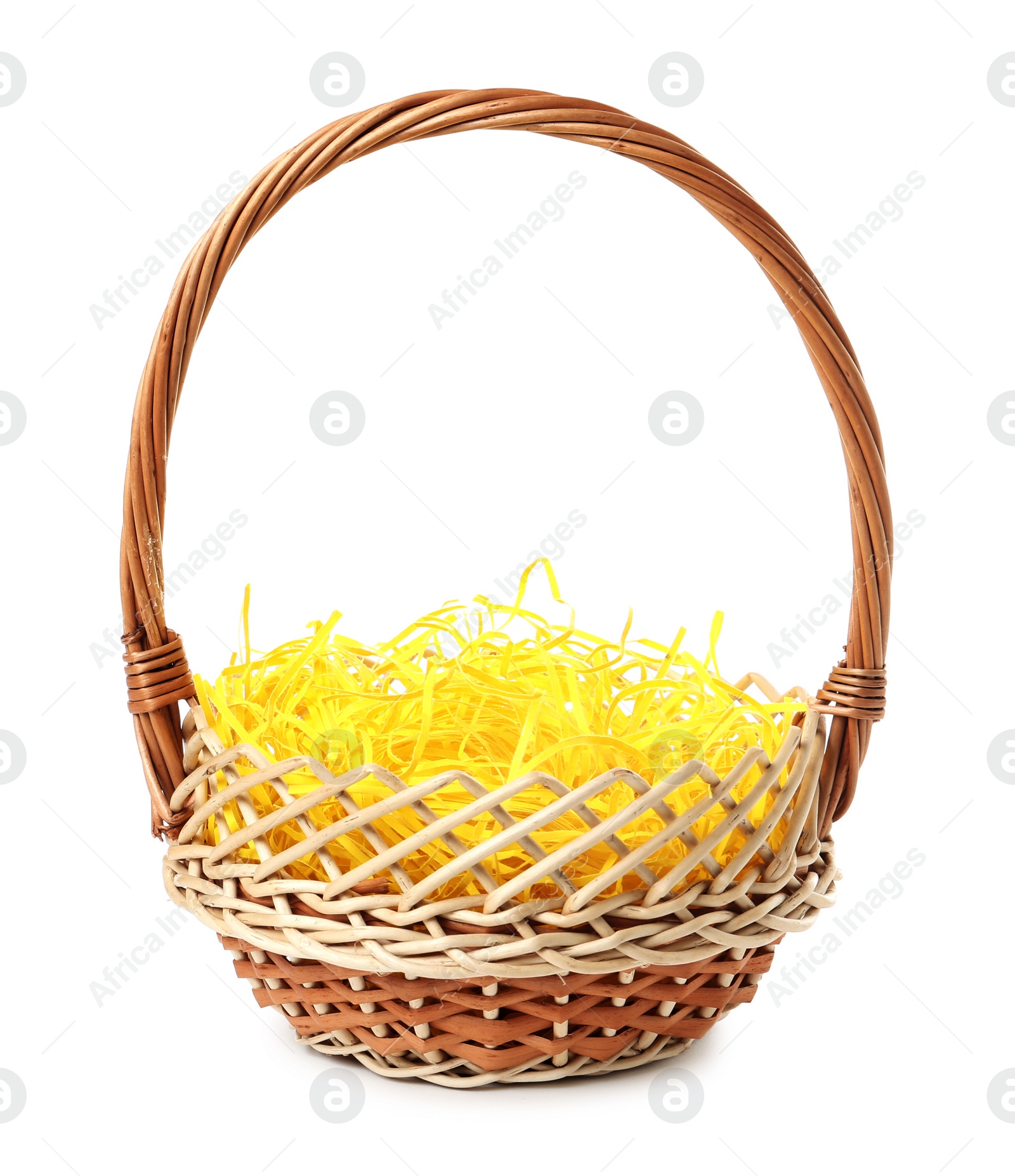 Wicker basket with yellow filler isolated on white. Easter item Photo of Wicker basket with yellow filler isolated on white. Easter item
