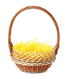 Wicker basket with yellow filler isolated on white. Easter item Photo of Wicker basket with yellow filler isolated on white. Easter item