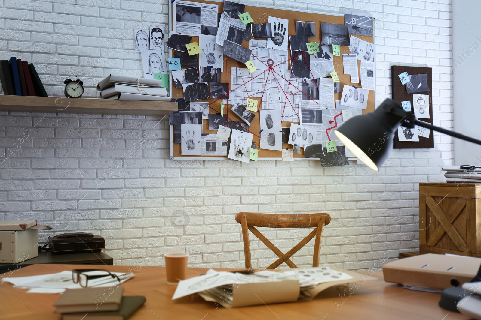 Detective office interior with workplace and investigation board Photo of Detective office interior with workplace and investigation board