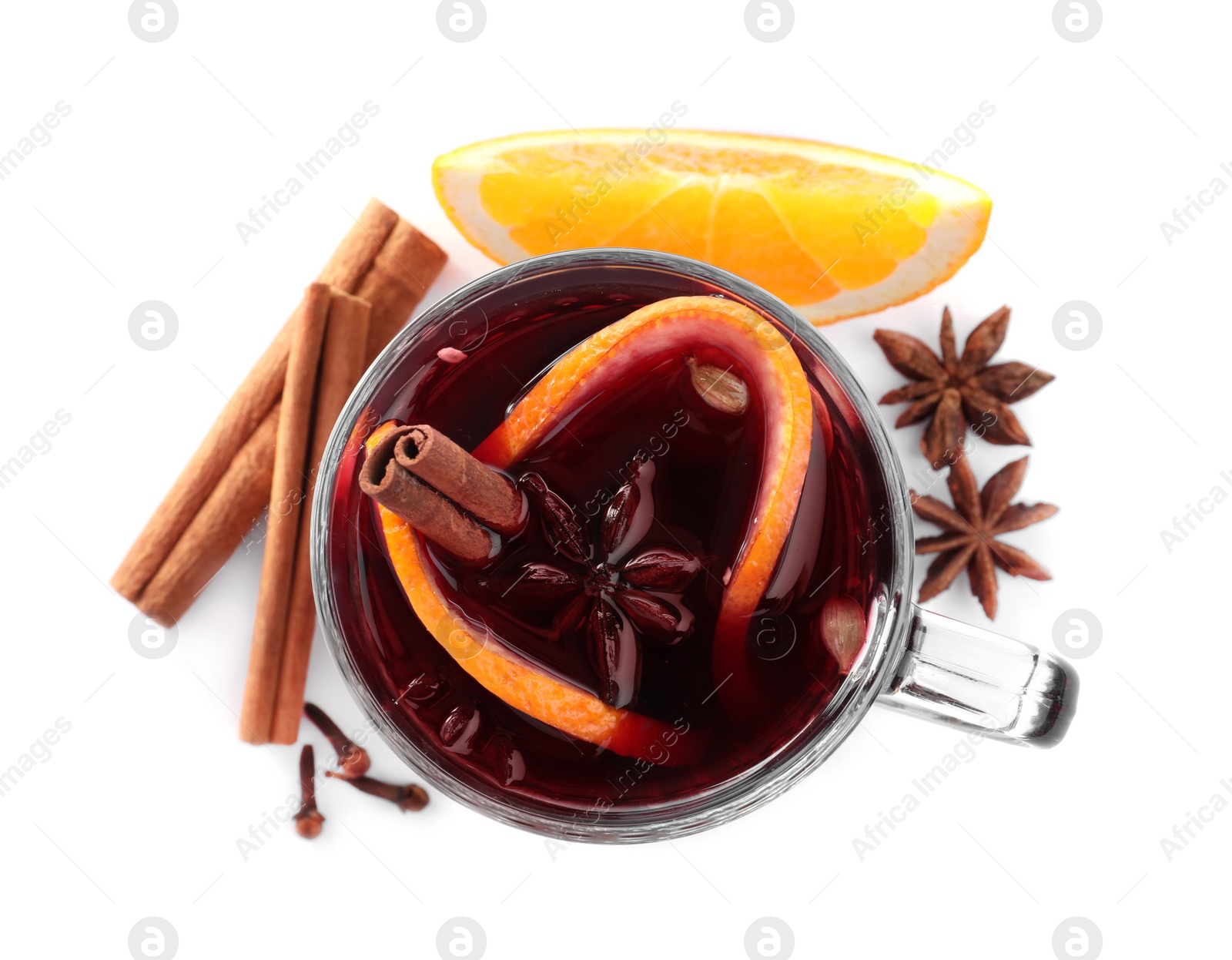 Photo of Aromatic mulled wine and ingredients on white background, top view