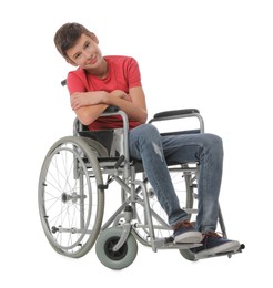 Teen boy in wheelchair on white background Photo of Teen boy in wheelchair on white background