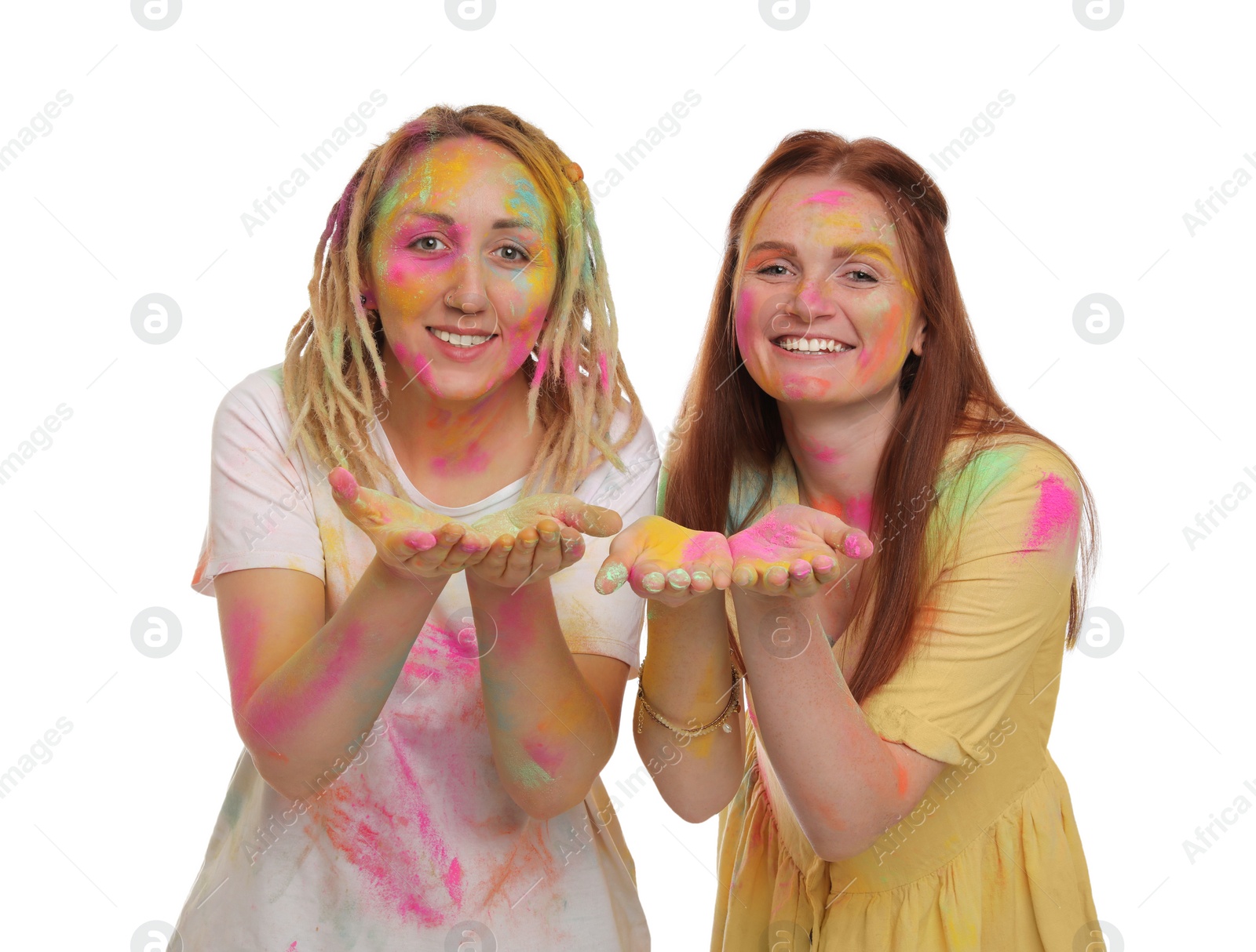 Women covered with colorful powder dyes on white background. Holi festival celebration Photo of Women covered with colorful powder dyes on white background. Holi festival celebration