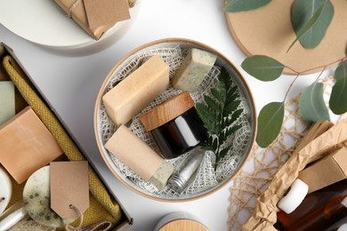 Cardboard boxes with eco friendly personal care products on white background, top view Photo of Cardboard boxes with eco friendly personal care products on white background, top view