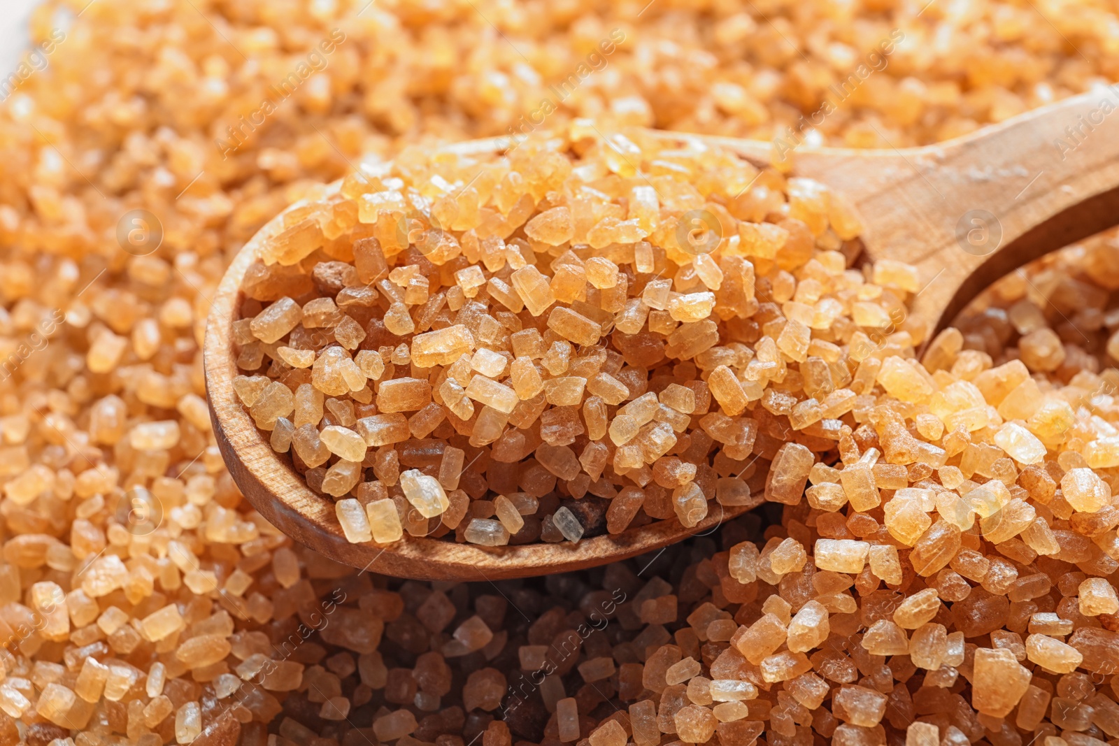 Spoon with brown sugar, closeup Photo of Spoon with brown sugar, closeup