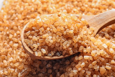 Spoon with brown sugar, closeup Photo of Spoon with brown sugar, closeup