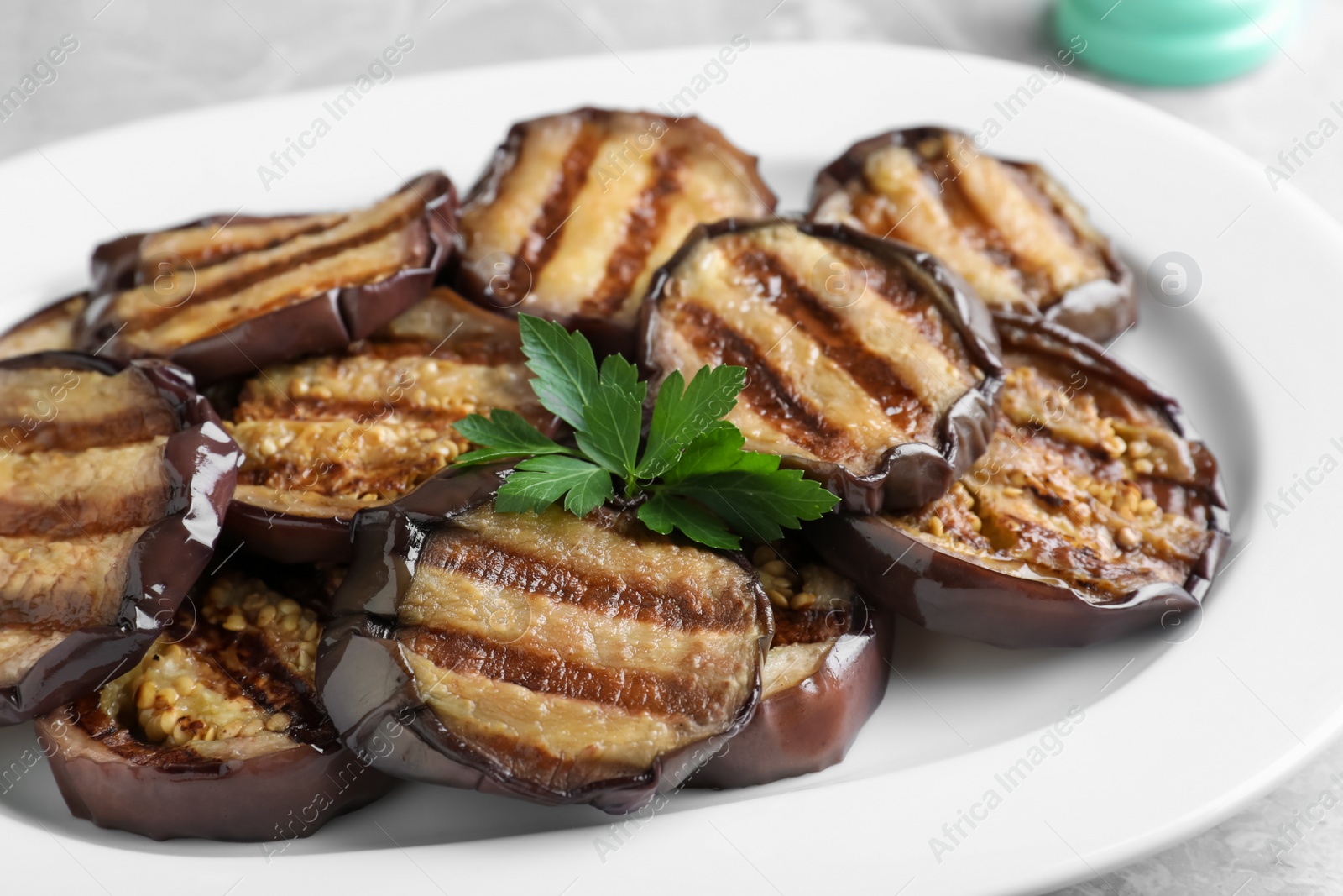 Delicious grilled eggplant slices on plate, closeup Photo of Delicious grilled eggplant slices on plate, closeup