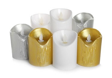 Different decorative flameless LED candles on white background Photo of Different decorative flameless LED candles on white background