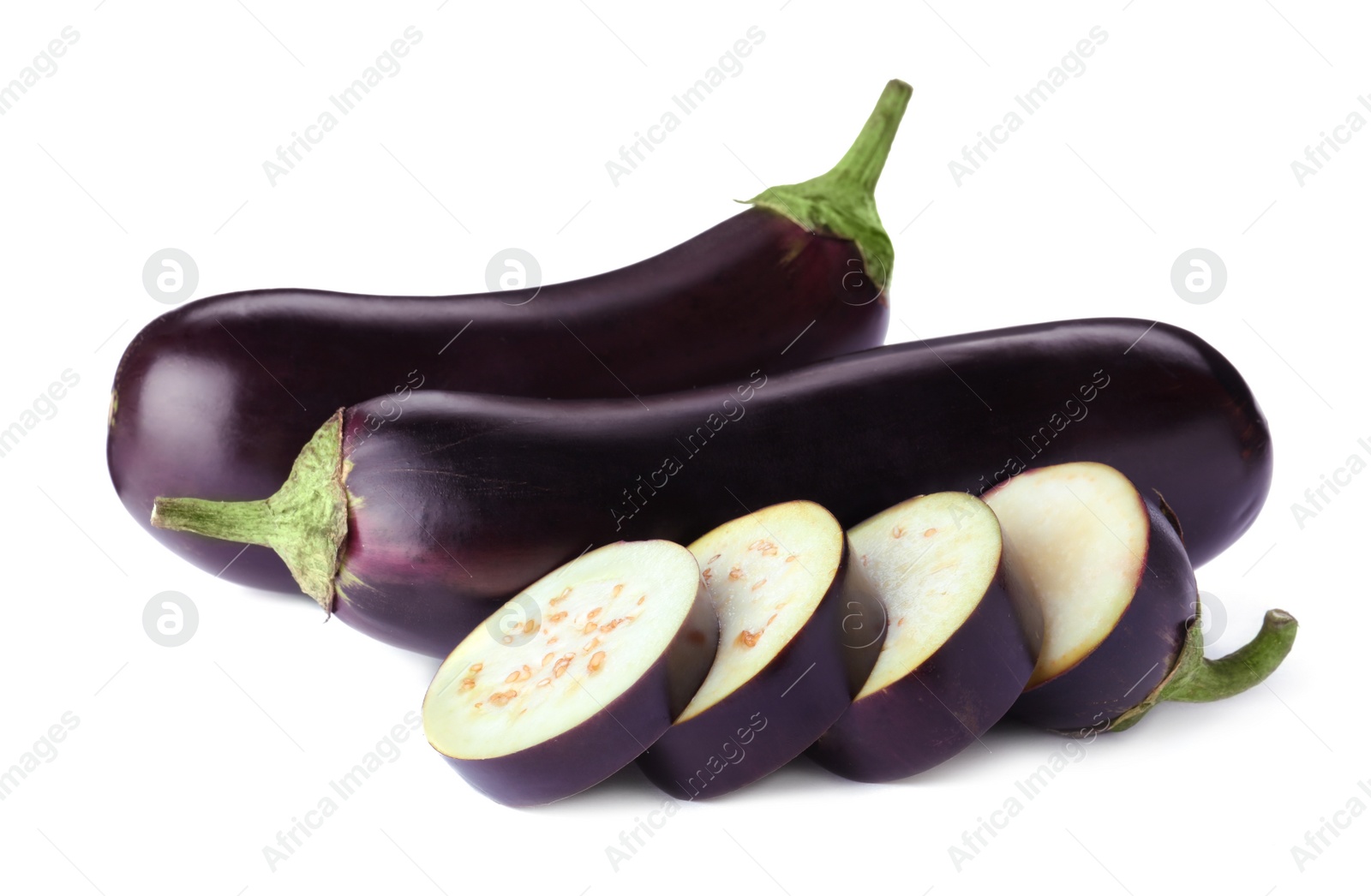 Cut and whole fresh ripe eggplants isolated on white Photo of Cut and whole fresh ripe eggplants isolated on white