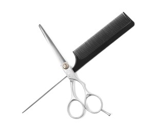 Professional hairdresser scissors and black comb isolated on white, top view. Haircut tools Photo of Professional hairdresser scissors and black comb isolated on white, top view. Haircut tools