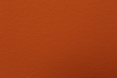 Orange textured surface as background, closeup view Photo of Orange textured surface as background, closeup view