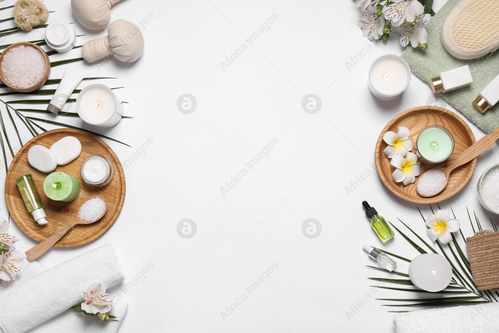 Flat lay composition with spa essentials on white background. Space for text Photo of Flat lay composition with spa essentials on white background. Space for text