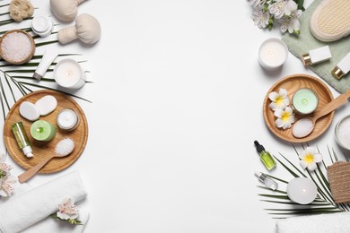 Flat lay composition with spa essentials on white background. Space for text Photo of Flat lay composition with spa essentials on white background. Space for text