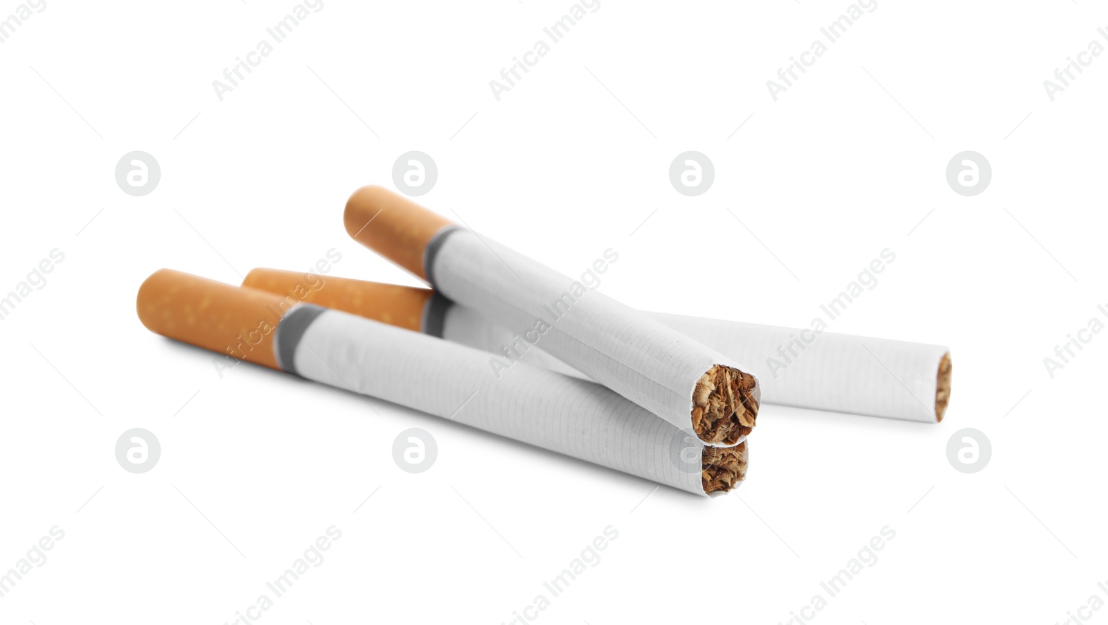 Cigarettes with orange filters isolated on white Photo of Cigarettes with orange filters isolated on white