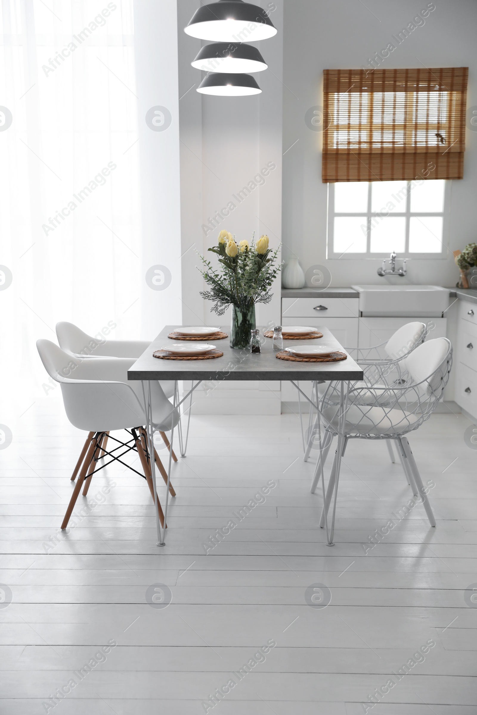 Photo of Beautiful dining room interior with new stylish furniture