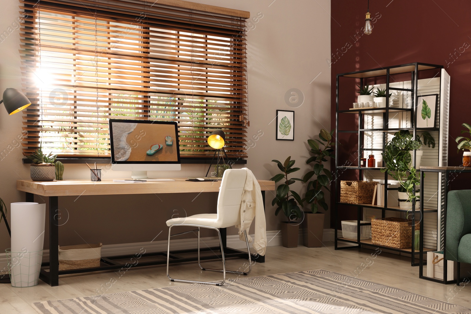 Photo of Light room interior with comfortable workplace near window