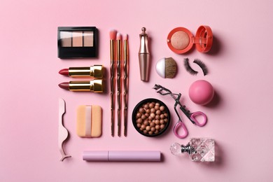 Flat lay composition with makeup products on pink background Photo of Flat lay composition with makeup products on pink background