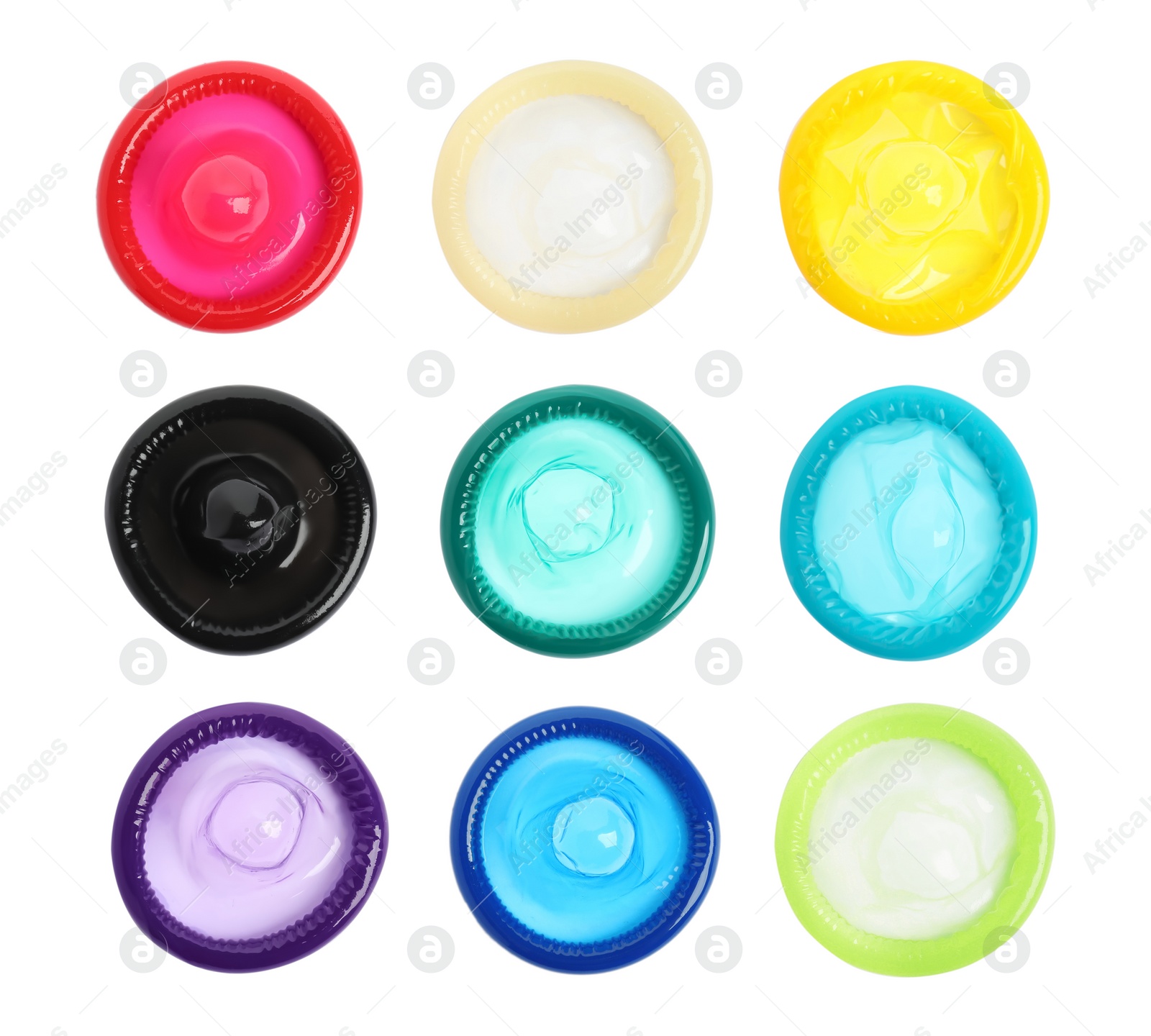 Set with different unpacked condoms on white background, top view Image of Set with different unpacked condoms on white background, top view