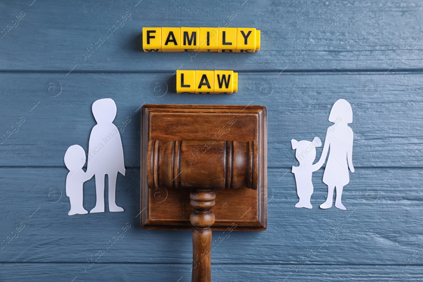 Family law concept. Flat lay composition with judge gavel on blue wooden background Image of Family law concept. Flat lay composition with judge gavel on blue wooden background