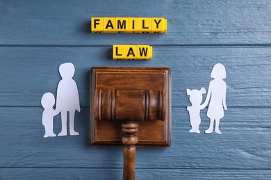 Family law concept. Flat lay composition with judge gavel on blue wooden background Image of Family law concept. Flat lay composition with judge gavel on blue wooden background