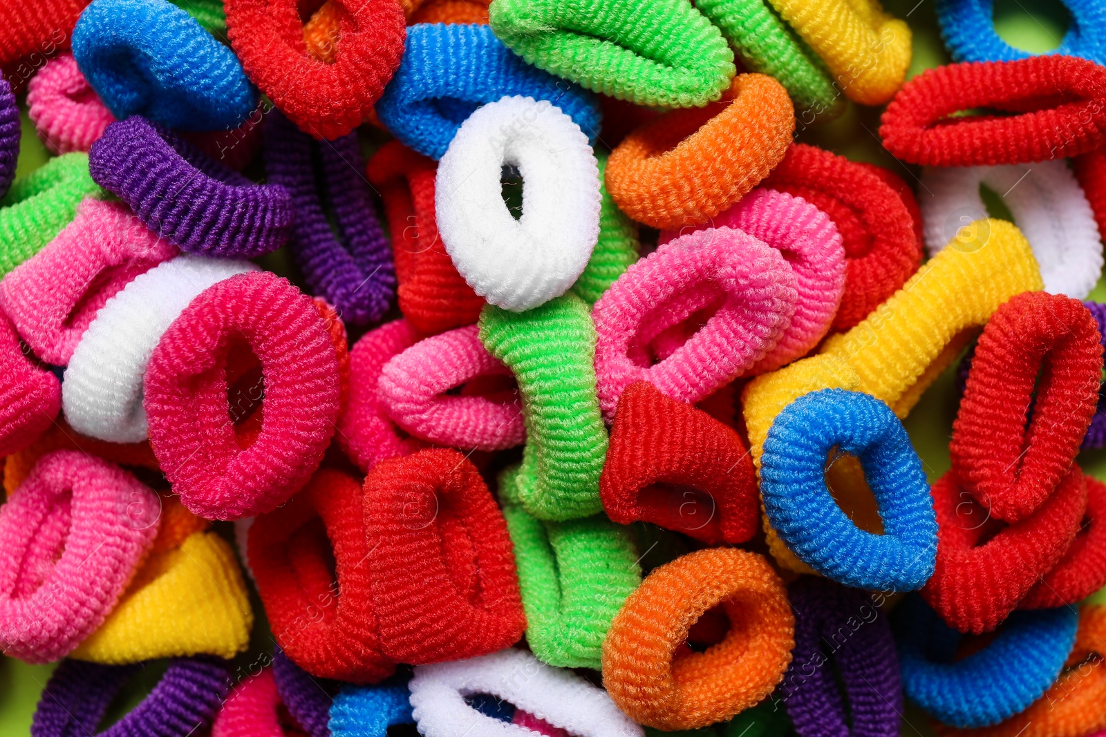 Different colorful hair ties as background, closeup Photo of Different colorful hair ties as background, closeup