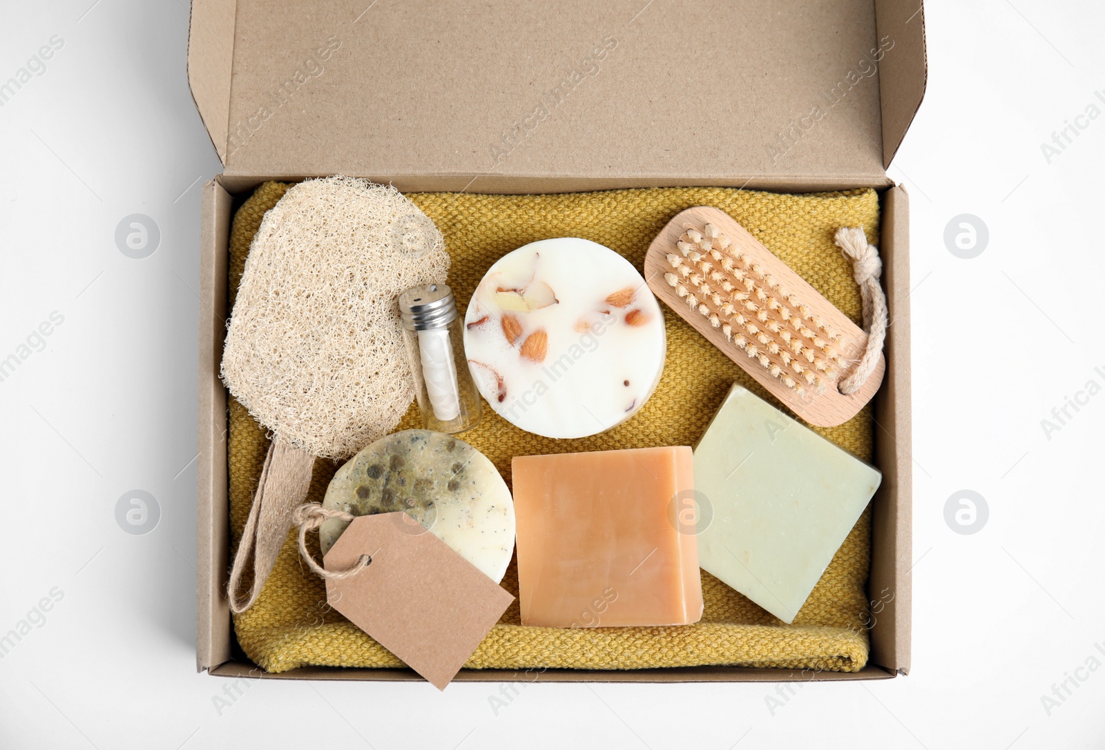 Cardboard box with eco friendly personal care products on white background, top view Photo of Cardboard box with eco friendly personal care products on white background, top view