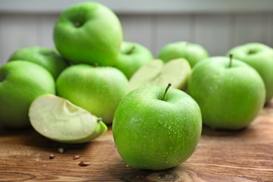 Fresh green apples on wooden table Photo of Fresh green apples on wooden table