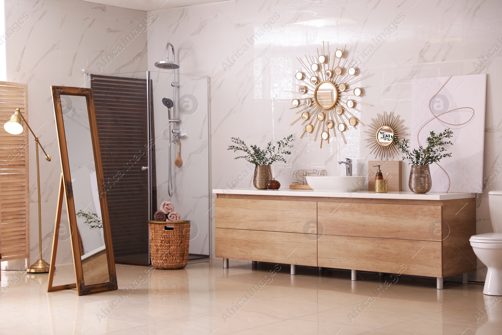 Modern bathroom interior with stylish mirror and vessel sink Photo of Modern bathroom interior with stylish mirror and vessel sink