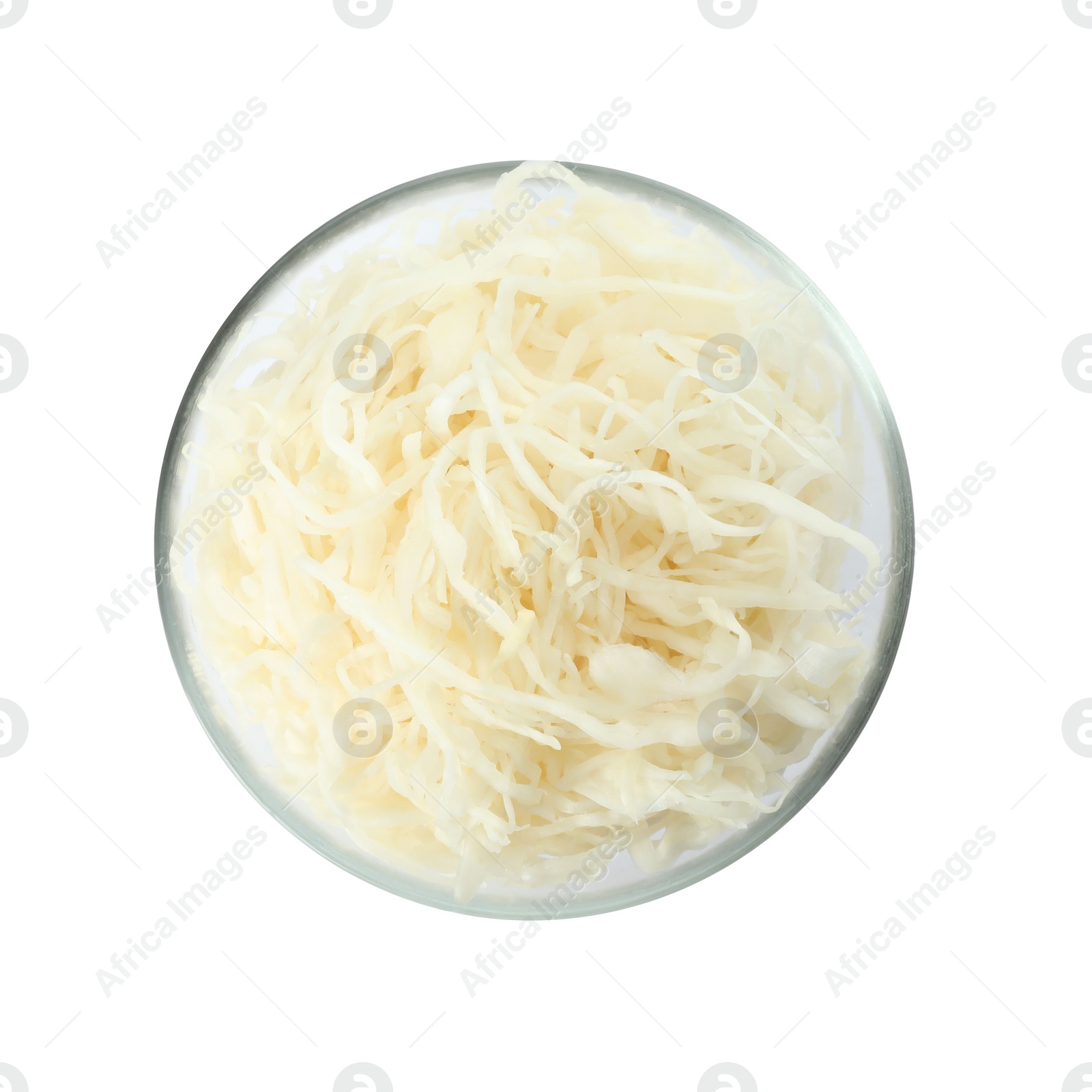 Photo of Glass bowl of tasty fermented cabbage isolated on white, top view