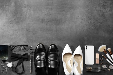 Fashionable male and female accessories on grey background, flat lay. Space for text Photo of Fashionable male and female accessories on grey background, flat lay. Space for text