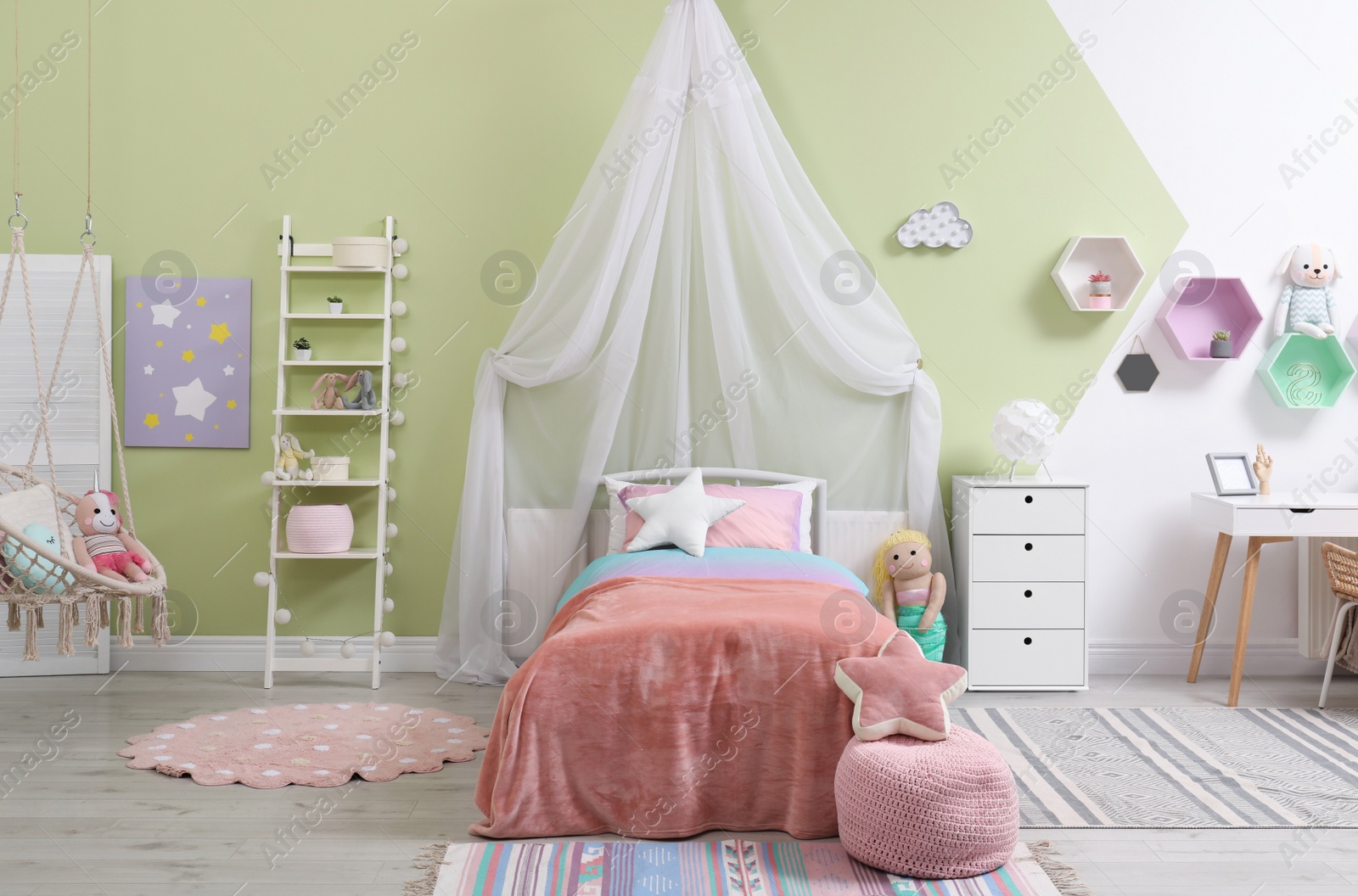 Photo of Cute child's room interior with toys and modern furniture