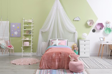 Cute child's room interior with toys and modern furniture Photo of Cute child's room interior with toys and modern furniture