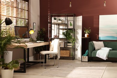 Light room interior with comfortable workplace near window Photo of Light room interior with comfortable workplace near window