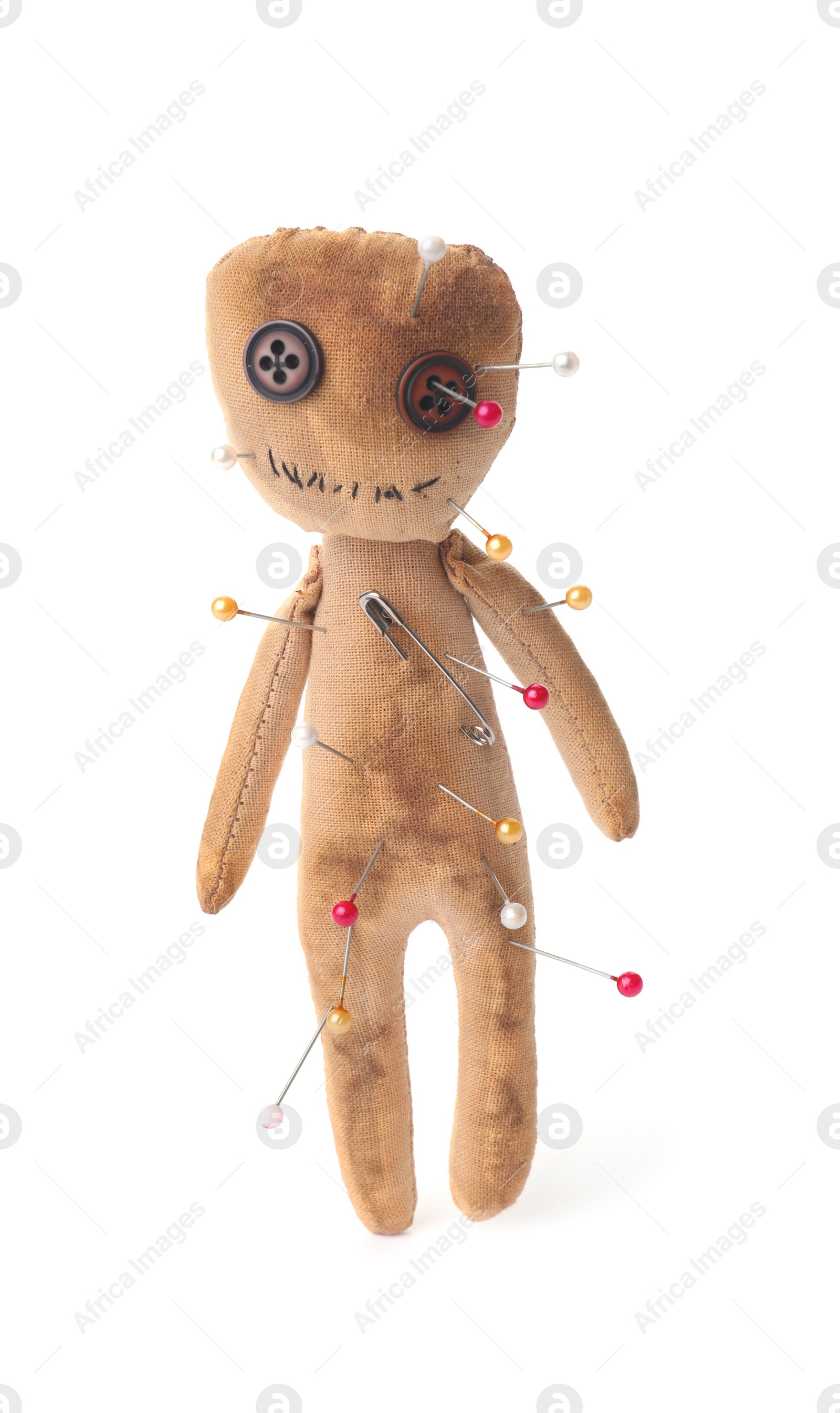 Voodoo doll with pins isolated on white Photo of Voodoo doll with pins isolated on white