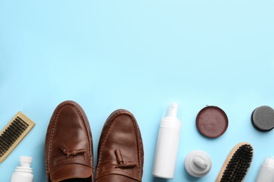 Flat lay composition with shoe care accessories and footwear on light blue background. Space for text Photo of Flat lay composition with shoe care accessories and footwear on light blue background. Space for text