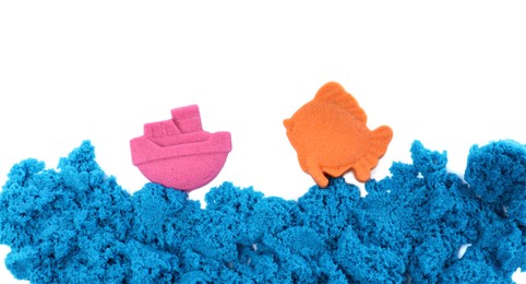 Ship, fish and sea made of kinetic sand on white background, top view Photo of Ship, fish and sea made of kinetic sand on white background, top view