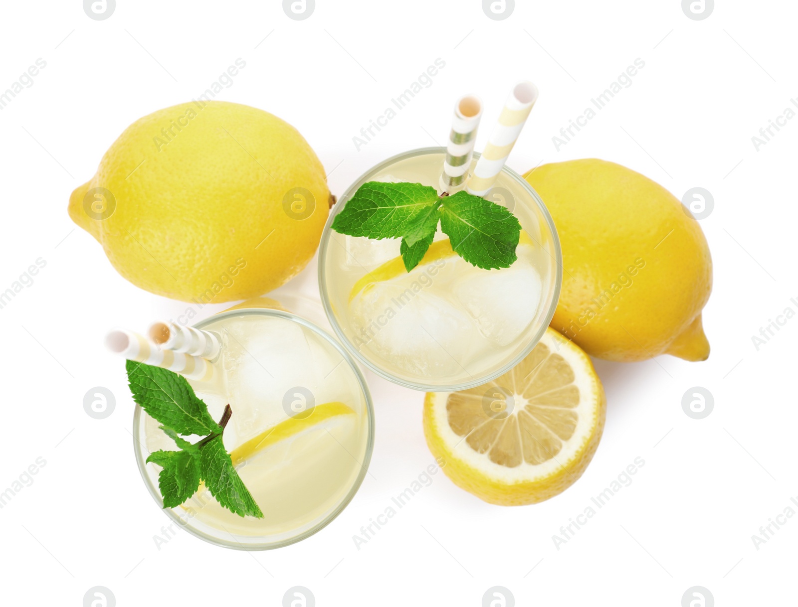 Natural lemonade with mint and fresh fruits on white background, top view. Summer refreshing drink Photo of Natural lemonade with mint and fresh fruits on white background, top view. Summer refreshing drink